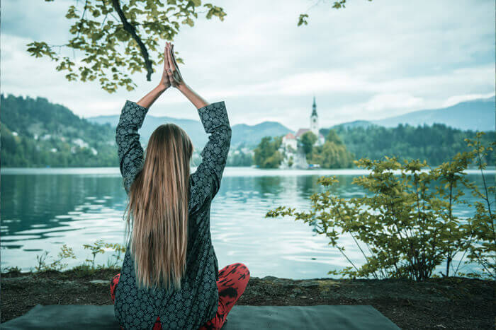 Meditating by the lake for Negative Ion Health Benefits